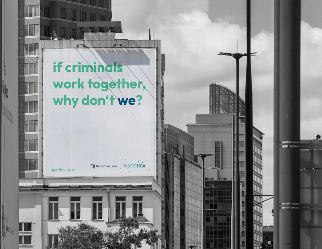 a billboard asking "if criminals work together, why don't we?" with the logos of rosemanl abs and spotixx